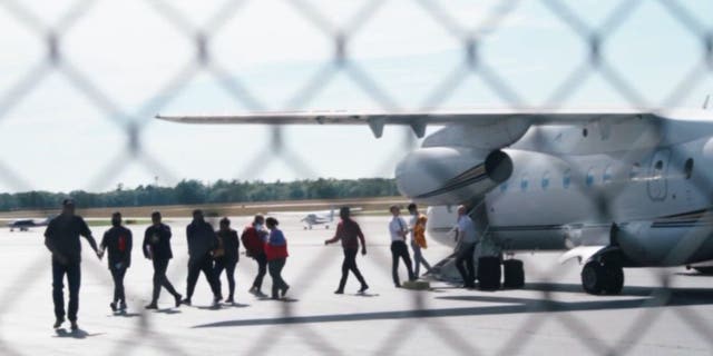 Illegal immigrants arrive at Martha's Vineyard Airport in Massachusetts on Sept. 14, 2022.