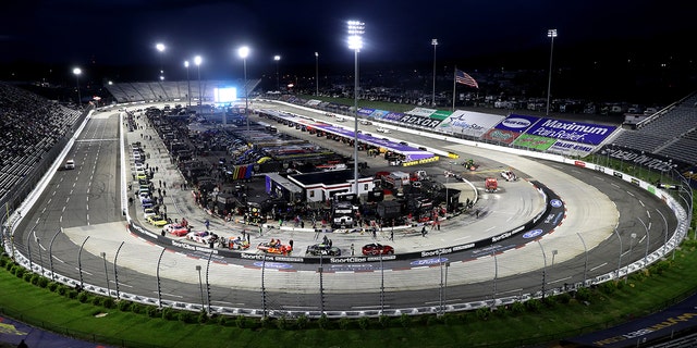 Cars parked on the grid during a rain delay prior to the NASCAR Xfinity Series Call 811 Before You Dig 250 at Martinsville Speedway on April 8, 2022, in Virginia.