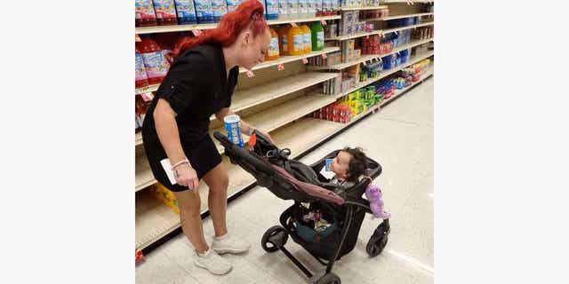 Jazmin Valentine, above, and her baby at a supermarket. Valentine filed a federal lawsuit on Sept. 27, 2022, alleging that nurses and staff at the Washington County jail in Maryland ignored her screams and plea for help as she gave birth to her daughter on the jail's floor.