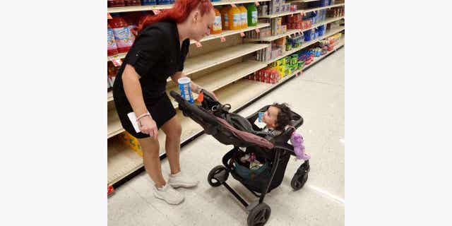 Jazmin Valentine, above, and her baby at a supermarket. Valentine filed a federal lawsuit on Sept. 27, 2022, alleging that nurses and staff at the Washington County jail in Maryland ignored her screams and plea for help as she gave birth to her daughter on the jail's floor.