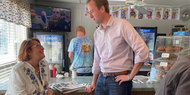 Republican US House candidate Matt Mowers, who's running in New Hampshire's 1st Congressional District, speaks with state Sen.  Regina Birdsell at the English Muffin diner in Hampstead, NH, on Sept.  12, 2022