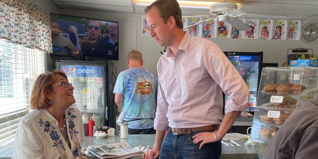 Matt Mowers, who's running in New Hampshire's 1st Congressional District, speaks with state Sen. Regina Birdsell at the English Muffin diner in Hampstead on Sept. 12, 2022.