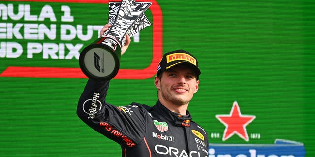 Race winner Max Verstappen celebrates on the podium during the F1 Grand Prix of The Netherlands at Circuit Zandvoort on Sept. 4, 2022.