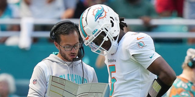 Quarterback Teddy Bridgewater (5) speaks with head coach Mike McDaniel of the Miami Dolphins during the first half against the Buffalo Bills at Hard Rock Stadium in Miami Gardens, Florida, on Sept. 25, 2022.