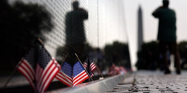 American flags are seen at the Vietnam Veterans Memorial on National POW/MIA Recognition Day on the National Mall on September 16, 2022, in Washington, D.C.