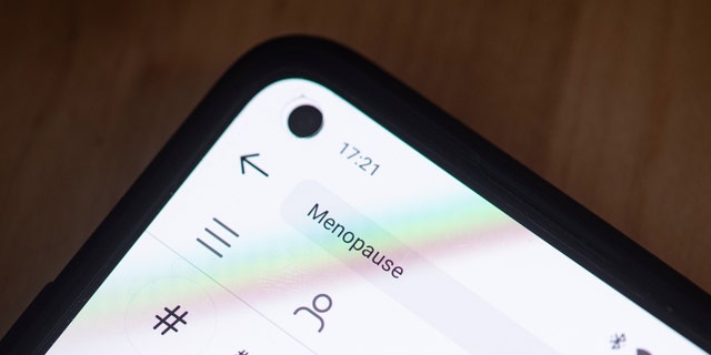 PRODUCTION - 28 FEBRUARY 2022, BERLIN: ILLUSTRATION - On a smartphone screen, the word menopause is written in the search box of the Instagram app.  Photo: Fabian Sommer/dpa
