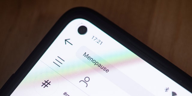 PRODUCTION - 28 FEBRUARY 2022, BERLIN: ILLUSTRATION - On a smartphone screen, the word menopause is written in the search box of the Instagram app.  Photo: Fabian Sommer/dpa