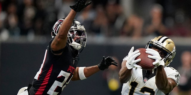 New Orleans Saints wide receiver Michael Thomas (13) makes a touchdown catch against the Atlanta Falcons during the second half of an NFL football game, Sunday, Sept. 11, 2022, in Atlanta.