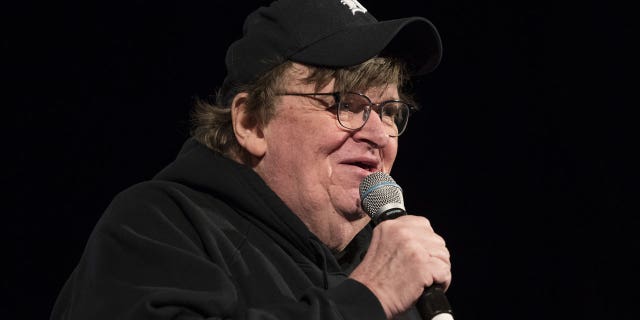 Michael Moore, American filmmaker, speaks during a campaign event for Senator Bernie Sanders, an independent from Vermont and former 2020 presidential candidate, during a town hall event in Rochester, New Hampshire, U.S., on Saturday, Feb. 8, 2020. 