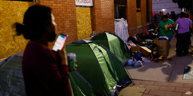 Migrants from Venezuela set up tents near a bus station after being released from U.S. Border Patrol custody Sept. 13, 2022, in El Paso, Texas.