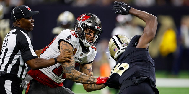 Marcus Maye (6) of the New Orleans Saints confronts Mike Evans of the Tampa Bay Buccaneers during the second half at Caesars Superdome in New Orleans on Sept. 18, 2022.