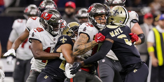 Saints cornerback Marshon Lattimore and safety Marcus Maye get into a penalty with Tampa Bay Buccaneers wide receiver Mike Evans at Caesars Superdome on Sept. 18, 2022, in New Orleans.