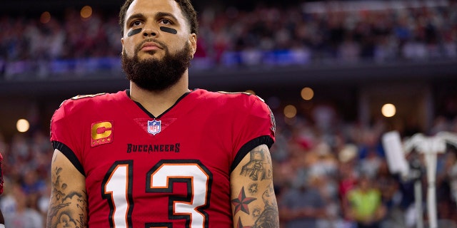 Mike Evans, #13 of the Tampa Bay Buccaneers, looks on before kickoff against the Dallas Cowboys at AT&T Stadium on Sept. 11, 2022 in Arlington, Texas.