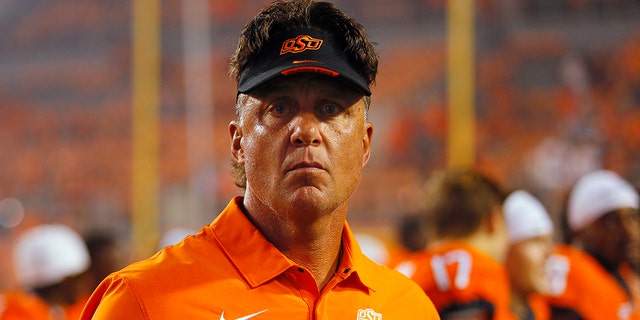Head coach Mike Gundy of the Oklahoma State Cowboys looks around the field after his 150th career win at OSU with a victory against the Central Michigan Chippewas at Boone Pickens Stadium Sept. 1, 2022, in Stillwater, Okla.