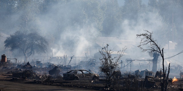A view of a burnt car and other burnt structures as the Mill Fire burns near Weed, California, U.S., September 2, 2022.