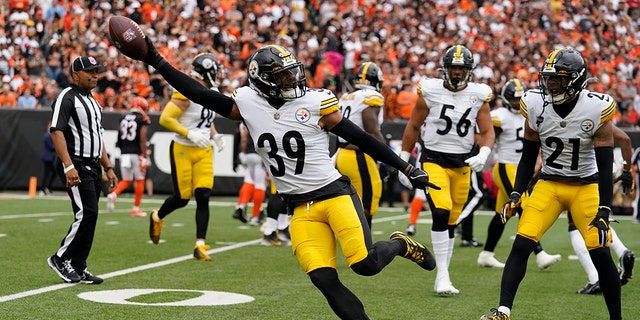 Pittsburgh Steelers safety Minkah Fitzpatrick (39) celebrates after returning an interception for a touchdown during the first half of a game against the Cincinnati Bengals Sept. 11, 2022, in Cincinnati.
