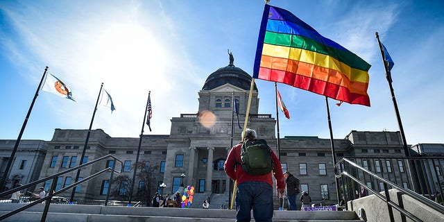 Demonstrators gather on the steps of the Montana State Capitol protesting anti-LGBTQ+ legislation on March 15, 2021, in Helena, Mont. 