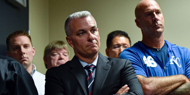 General manager Dayton Moore (center) listens to manager Ned Yost talk about retiring from baseball prior to a game against the Atlanta Braves at Kauffman Stadium on Sept. 24, 2019 in Kansas City, Missouri. Yost, who led the the Royals to a World Series title in the 2015 and is the team's winningest manager, will retire following the finial game of the season on Sept. 29.