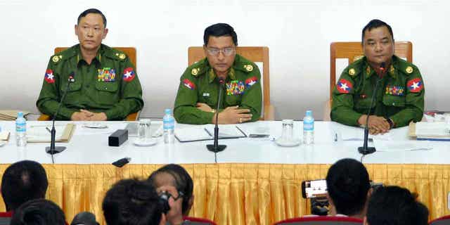 Major General Zaw Min Tun, right, says the killing of a passenger plane in Myanmar was perpetrated by terrorists belonging to the Karenni National Progressive Party.