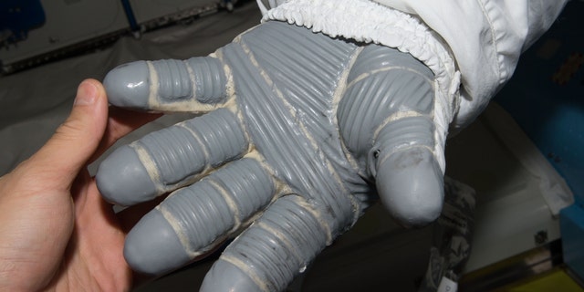Spacesuit gloves must be insulated against extreme space temperatures.  NASA funding to explore phase change materials in this application resulted in a fabric material that is now found in many products.
