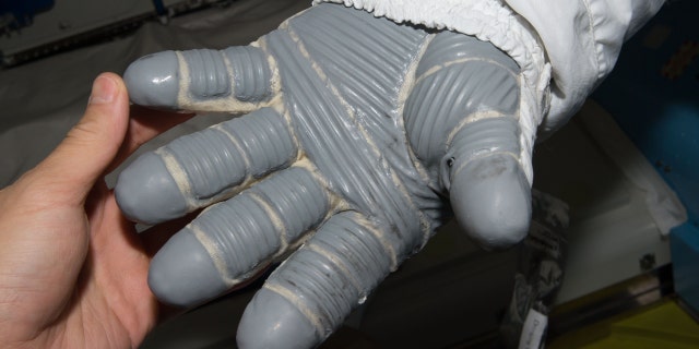 Spacesuit gloves must be insulated against extreme space temperatures.  NASA funding to explore phase change materials in this application resulted in a fabric material that is now found in many products.