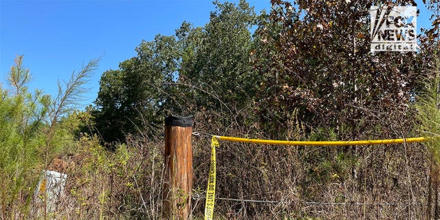 A police line near where the remains of missing teens Lyric Woods and Devin Clark were found.