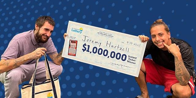 Jeremy Hartzell, 25, poses with his brother after winning the $1 million lottery prize on a $10 scratch-off ticket.
