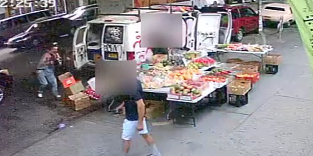 The victim is seen being chased by the suspect on the left side of this screen grab of surveillance video released by the NYPD.