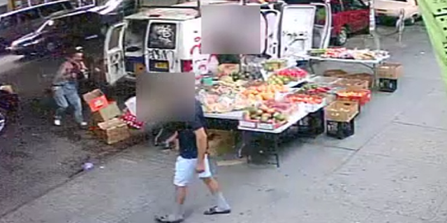 The victim is seen being chased by the suspect on the left side of this screen grab of surveillance video released by the NYPD.