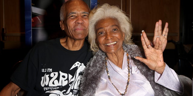 Kyle Johnson often attended "Star Trek" conventions with mother Nichelle Nichols (seen in 2019). He said her final deep-space mission would be a true honor.