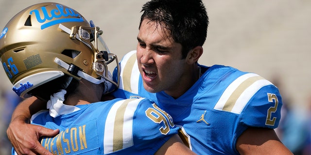 UCLA place kicker Nicholas Barr-Mira, #2, celebrates with place kicker Ari Libenson, #96, after Barr-Mira kicked a field goal to win an NCAA college football game against South Alabama in Pasadena, California, Saturday, Sept. 17, 2022.