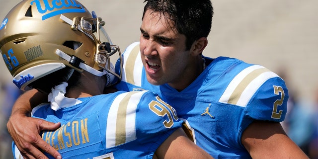 UCLA player Nicholas Barr-Mira, No. 2, celebrates with runner-up Ari Liebenson, No. 96, after Barr-Mira scored a field goal to win an NCAA college football game against South Alabama in Pasadena, California Saturday, September 17, 2022.
