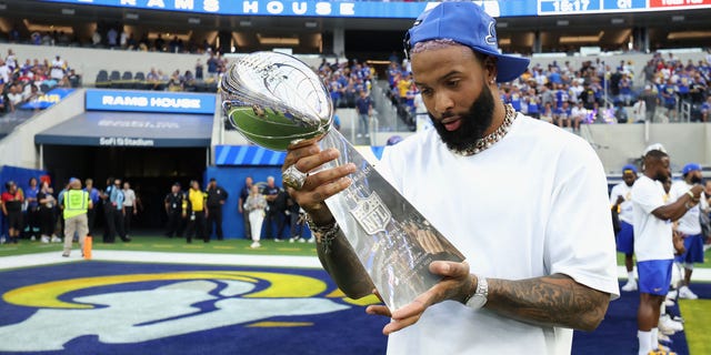 Odell Beckham Jr. holds the Super Bowl LVI trophy before a game against the Buffalo Bills at SoFi Stadium in Inglewood, CA on Sept. 8, 2022.