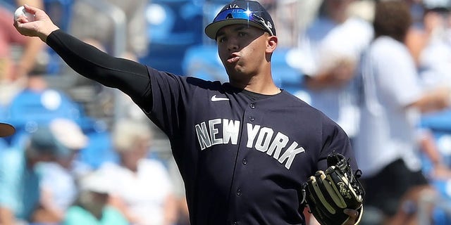 New York Yankees shortstop Oswald Peraza throws the ball over to first base during the spring training game against the Toronto Blue Jays at TD Ballpark in Dunedin, Florida, on March 22, 2022.