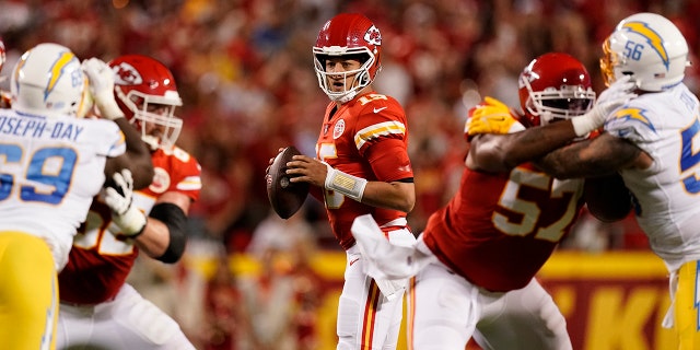 Kansas City Chiefs quarterback Patrick Mahomes drops back to pass during the first half of a game against the Los Angeles Chargers Thursday, Sept. 15, 2022, in Kansas City, Mo.