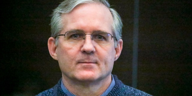 FILE - Paul Whelan, a former U.S. Marine who was arrested for alleged spying, listens to the verdict in a courtroom at the Moscow City Court in Moscow, Russia, June 15, 2020.