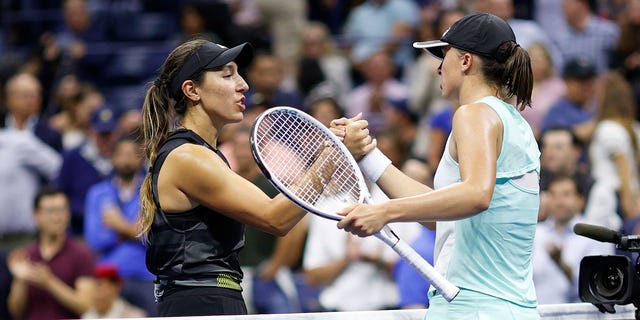 Poland's Iga Swirtek (right) shakes hands after defeating USA's Jessica Pegula in the singles quarterfinals of the 2022 US Open at the USTA Billie Jean King National Tennis Center.  September 7, 2022, Flushing District, Queens. New York City.