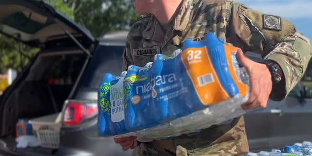 The Army and National Guard give residents bottled water