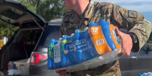 The Army and National Guard give residents bottled water