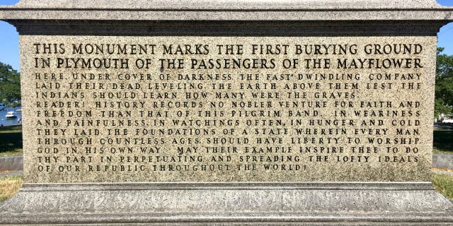 A monument overlooking the harbor in Plymouth, Massachusetts, marks the site where the Pilgrims buried their dead the first winter of 1620-21, when nearly half of the 100 settlers died. "In hunger and cold they laid the foundations of a state wherein every man through countless ages should have liberty to worship God in his own way," reads the monument. 