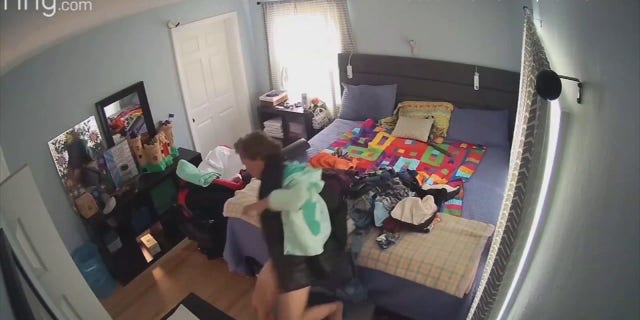 Smith initially thought that the person under the pile of clothes was her husband and called his name, but got no response. She then realized that a homeless person was on the bed.