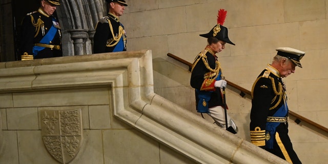 King Charles III, Anne, Princess Royal, Prince Andrew, Duke of York and Prince Edward keep watch for the Queen.