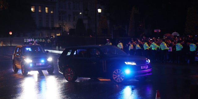 Prince William and Kate Middleton reportedly traveled in a separate vehicle to join the royal family as Queen Elizabeth's coffin arrived at Buckingham Palace in London. 