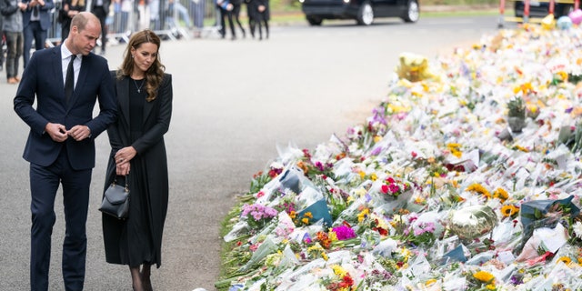 Prince William, Prince of Wales and Catherine, Princess of Wales view floral tributes at Sandringham on September 15, 2022 in King's Lynn, England.