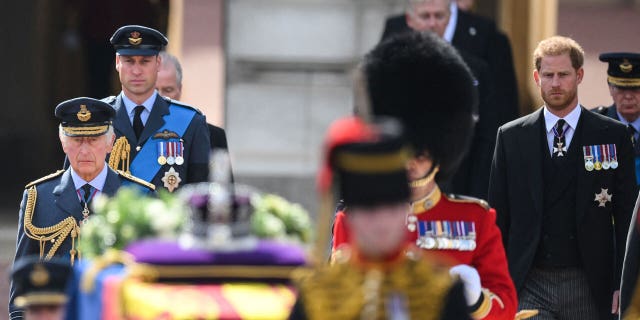 Prince Harry and Prince William joined their father King Charles III as Queen Elizabeth II's coffin was moved from Buckingham Palace to Westminster Hall.