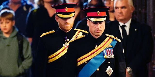 Princes Harry and William, dressed in military uniform, attend a vigil for Queen Elizabeth II.