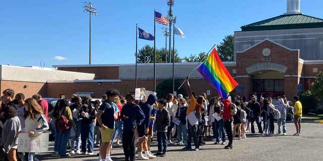 Students at McLean High School in McLean, Va., walk out of classes Tuesday, Sept. 27, 2022, to protest Republican Gov. Glenn Youngkin's proposed changes to the state's guidance on district policies for transgender students. 