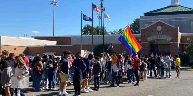 Students at McLean High School in McLean, Va., walk out of classes Tuesday, Sept. 27, 2022, to protest Republican Gov. Glenn Youngkin's proposed changes to the state's guidance on district policies for transgender students.