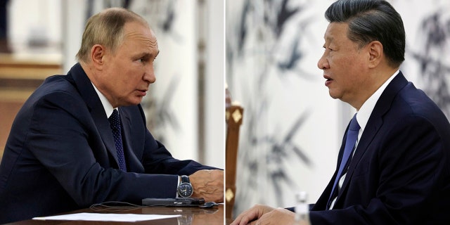 Chinese President Xi Jinping talks to Russian President Vladimir Putin at the SCO summit in Samarkand, Uzbekistan, Thursday, Sept. 15, 2022.