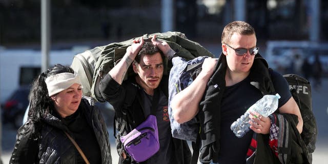 Travelers from Russia cross the border to Georgia at the Zemo Larsi/Verkhny Lars station, Georgia Sept. 26, 2022.